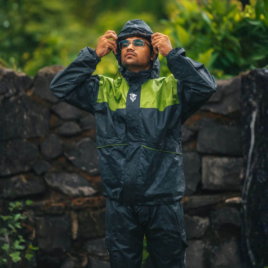 Hurricane Air TourPro Waterproof Rain Overjacket - Grey+Green worn outdoors with hood up and glasses